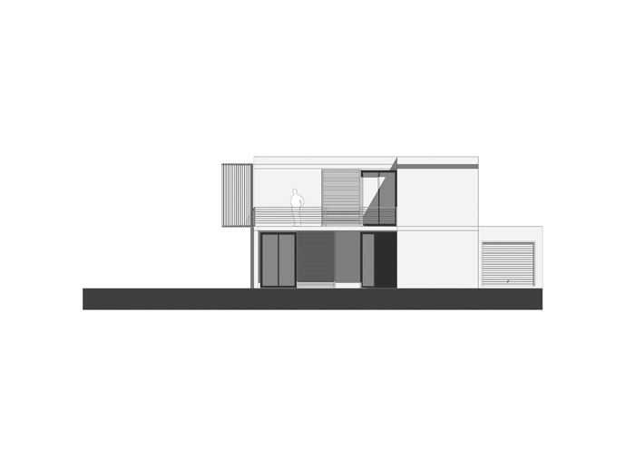 Maison contemporaine à Chanteloup (77) : Façade Est : entrée abritée par la terrasse.
